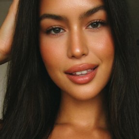 Thanya, 25, a brunette Thai woman